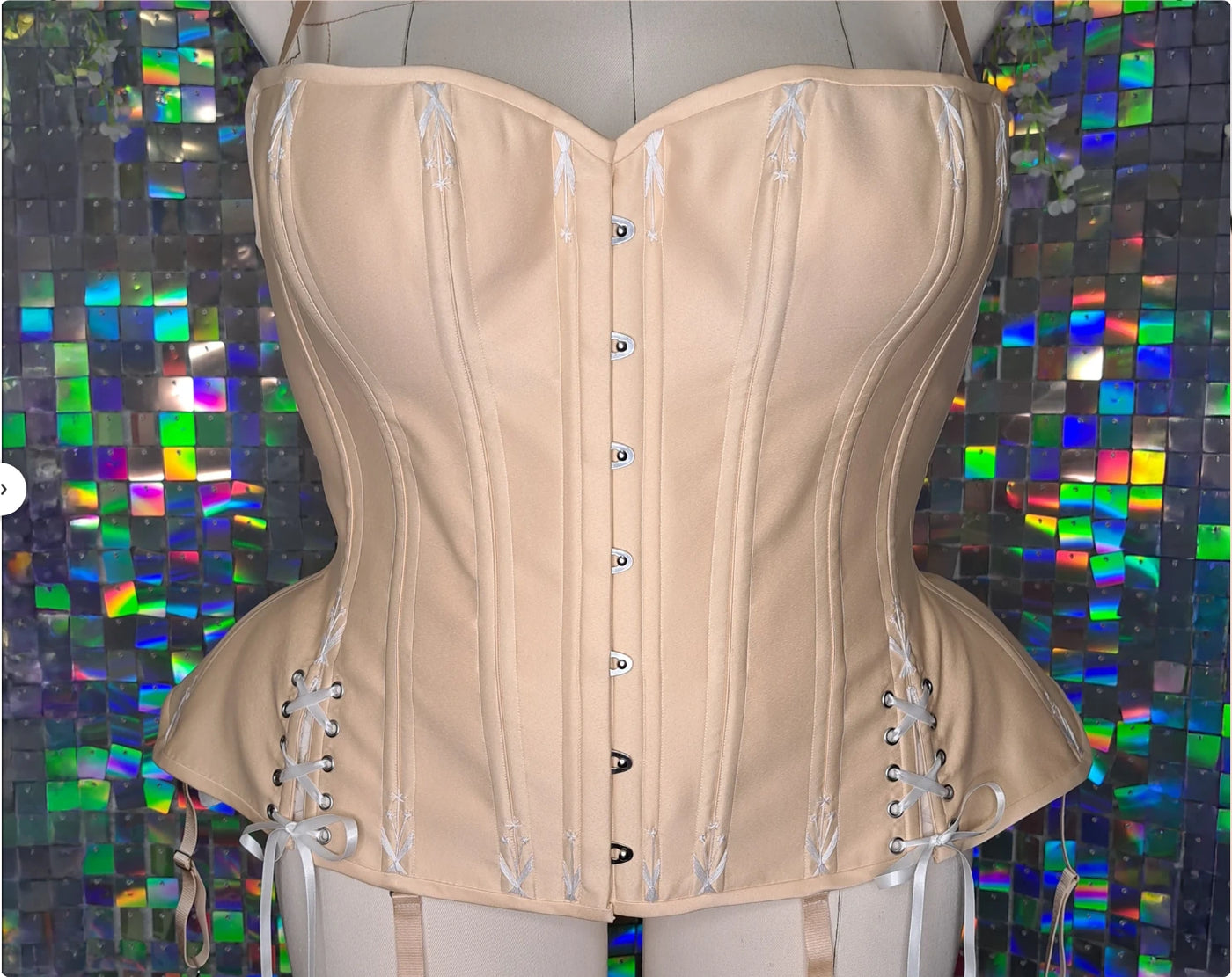 Glossy satin overbust corset with busk and flossing — the finished corset