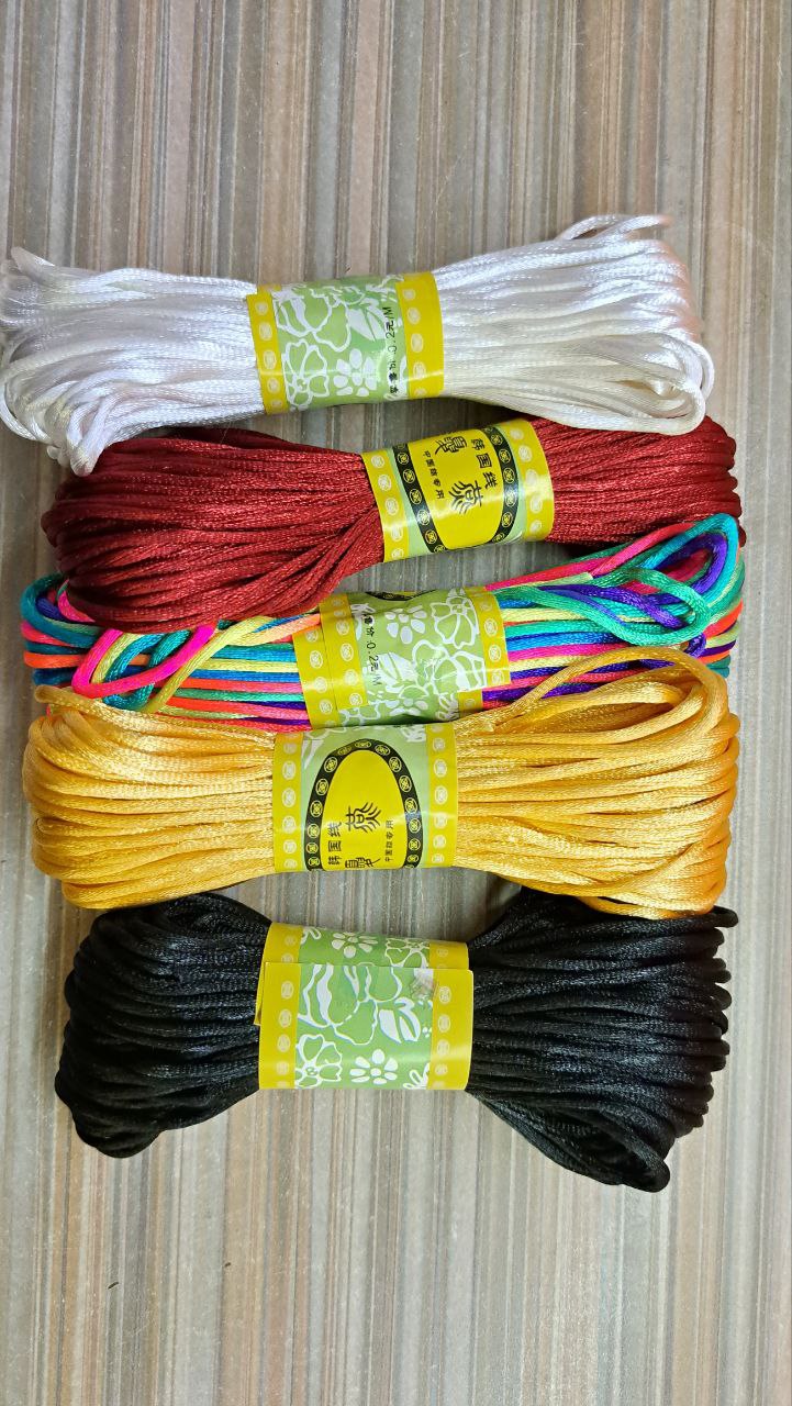 Extra skein of cord or ribbon